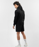 Rear view of Falcon black hoodie showing its plain back and hood